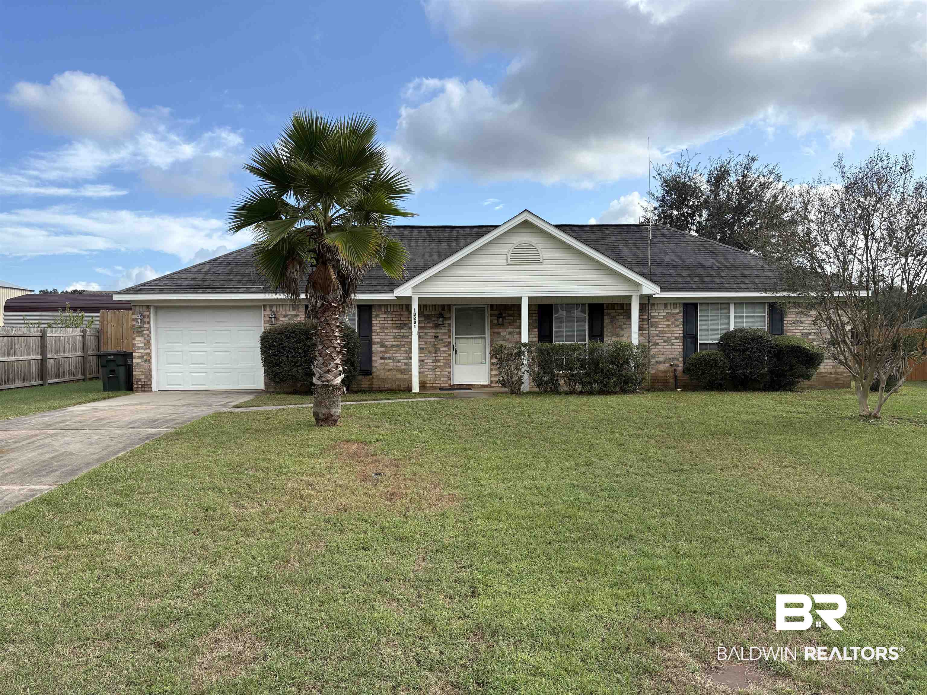 13281 Labradors Run Foley, AL 36535 - Photo 1 of 7 Ranch-style house featuring driveway, a garage, brick siding, and a shingled roof