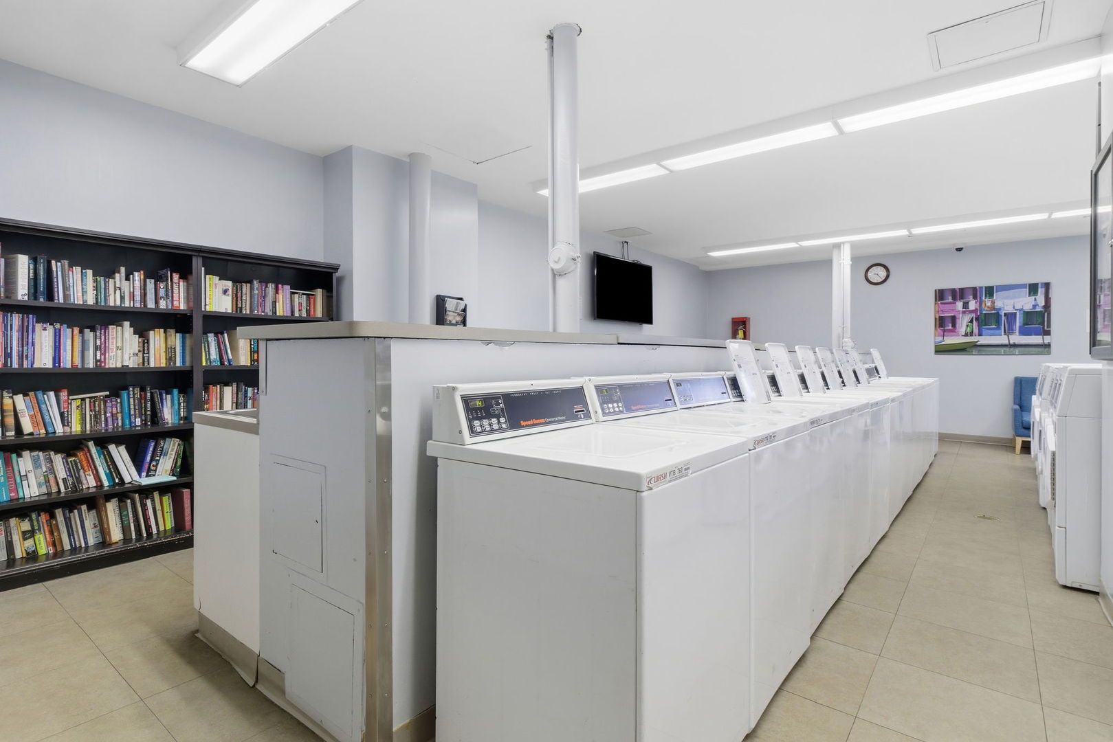 1030 North State Street, Unit 35K Chicago, IL 60610 - Photo 16 of 28 a utility room with washer and dryer