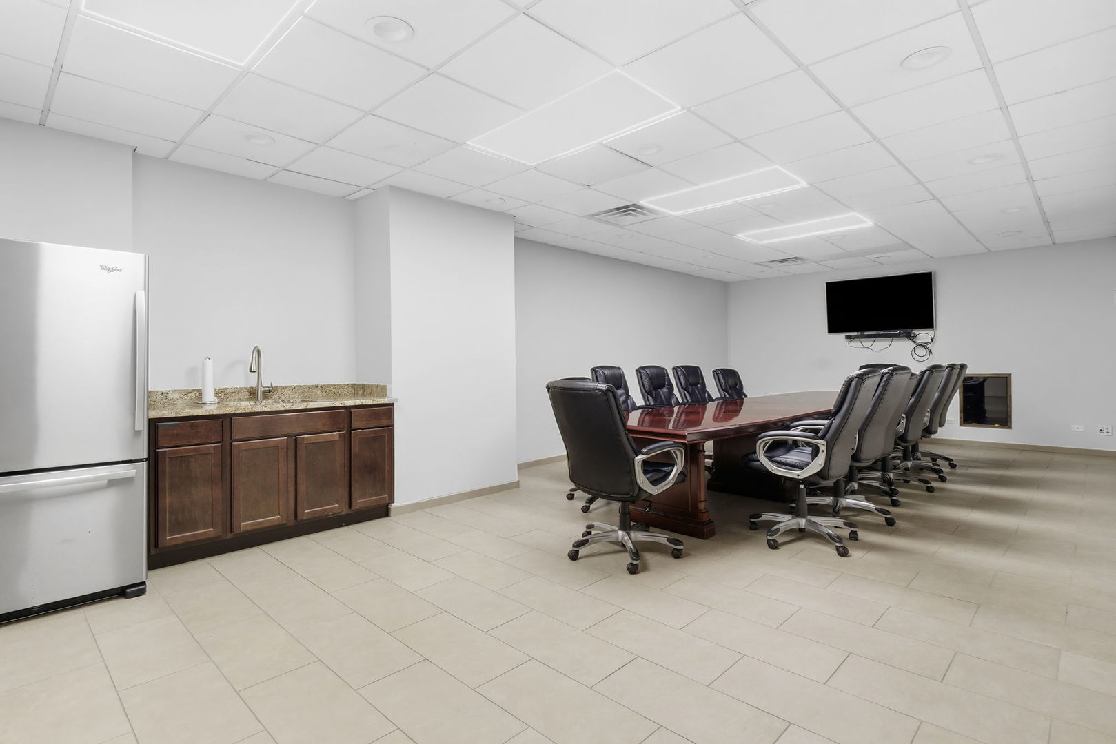 1030 North State Street, Unit 35K Chicago, IL 60610 - Photo 18 of 28 a view of a workspace with furniture and a kitchen