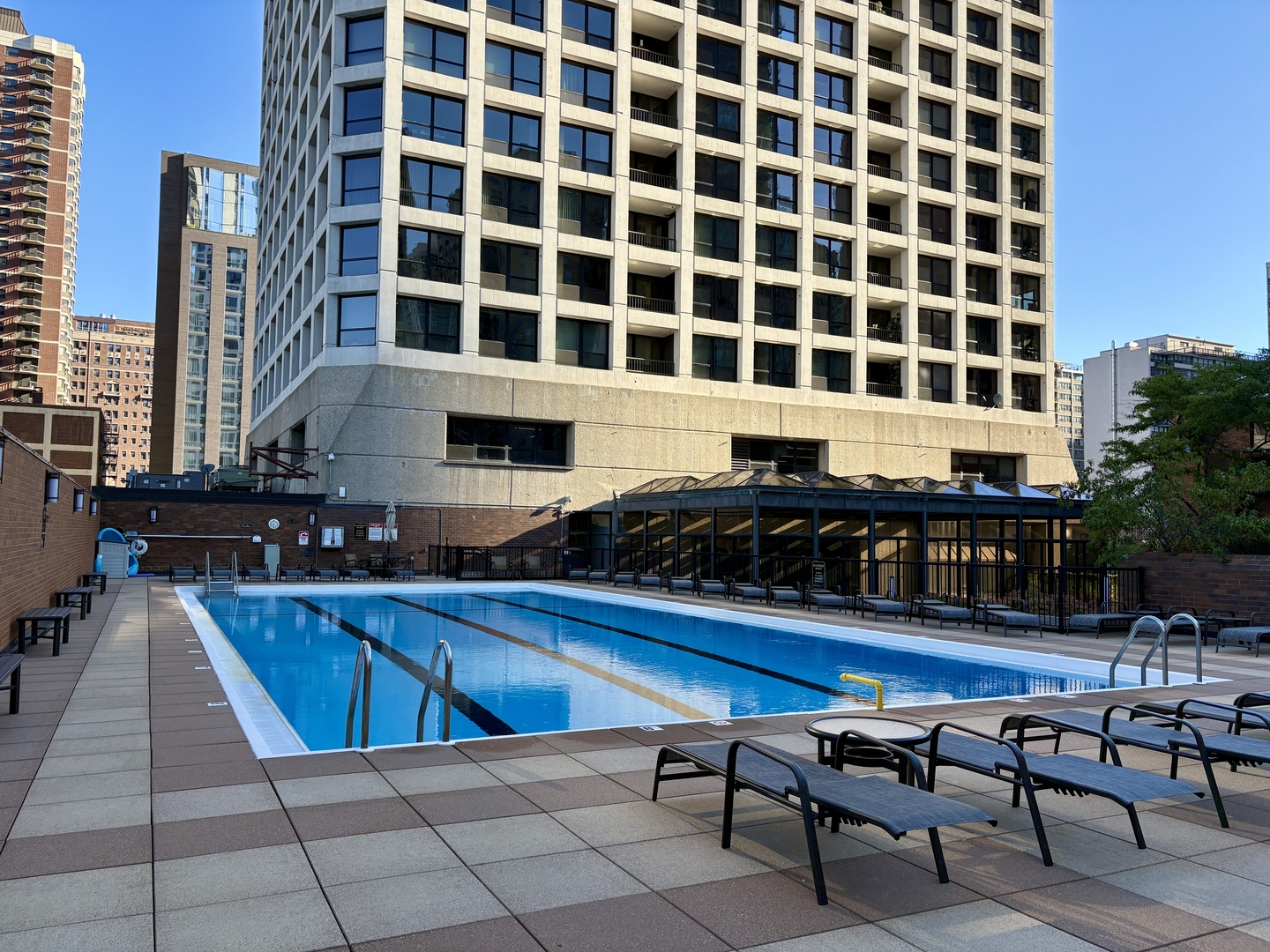 1030 North State Street, Unit 35K Chicago, IL 60610 - Photo 20 of 28 a swimming pool with outdoor seating