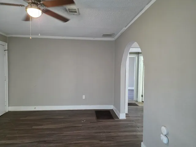 a view of room with window and hardwood floor