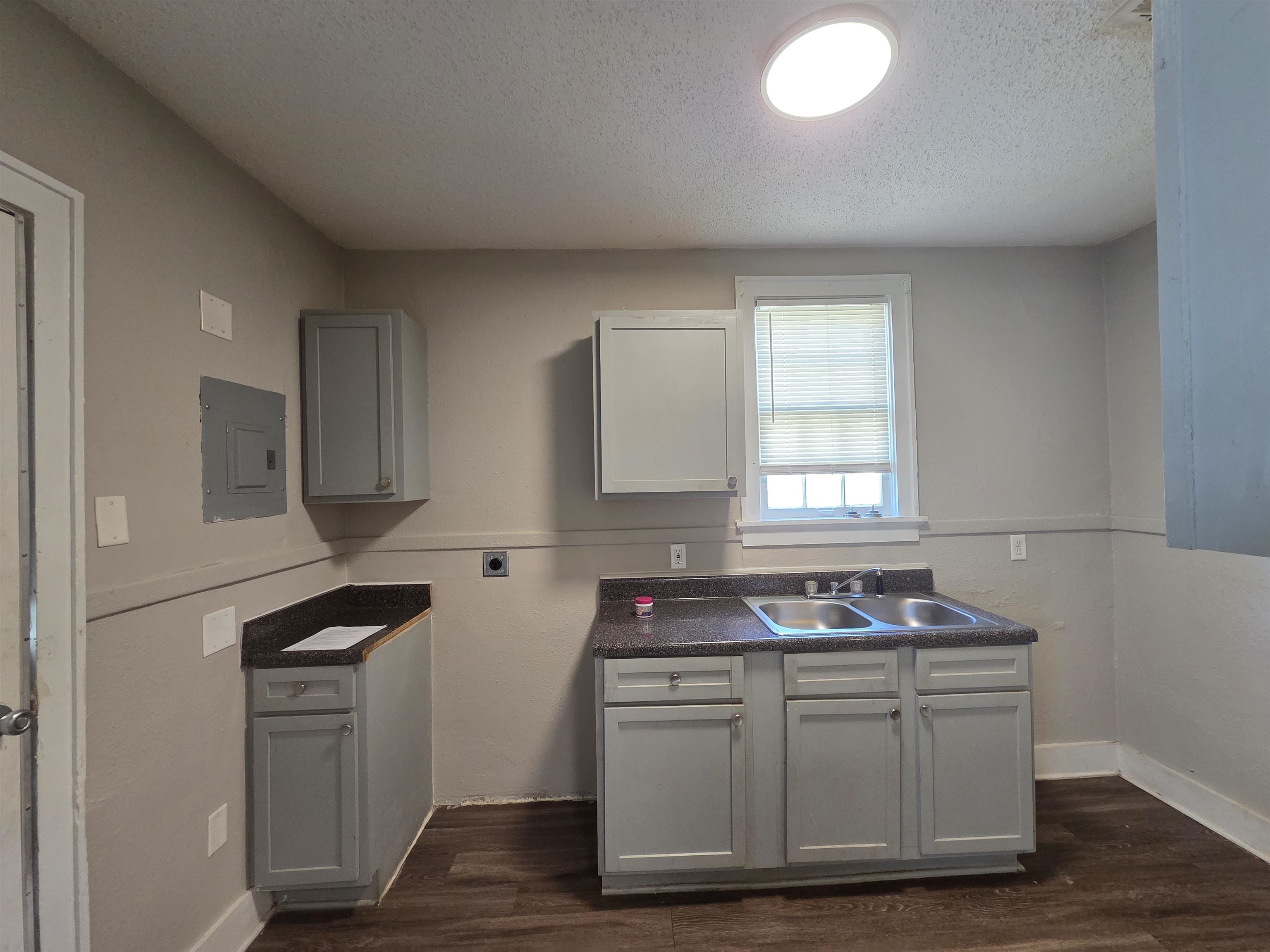 775 Pope Street Memphis, TN 38112 - Photo 8 of 13 a kitchen with granite countertop a sink cabinets and stainless steel appliances