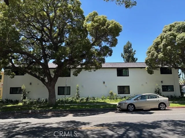 a view of street with parked cars