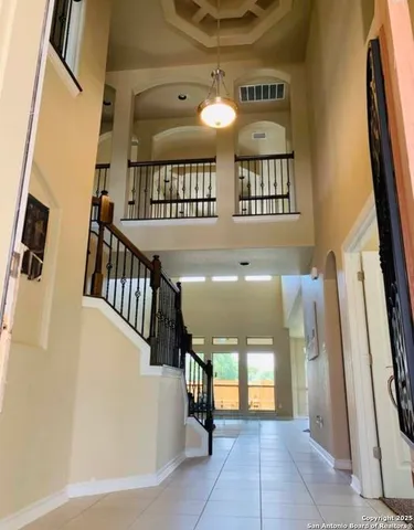 a view of entryway and hall with a front door