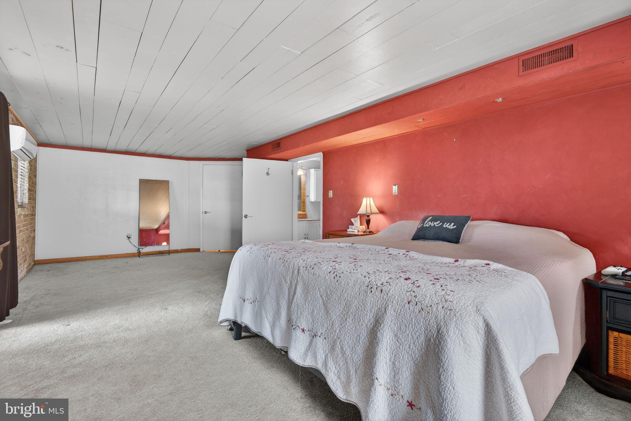 579 Hi View Drive Lititz, PA 17543 - Photo 33 of 55 Wood ceiling & brick wall add detail to this room