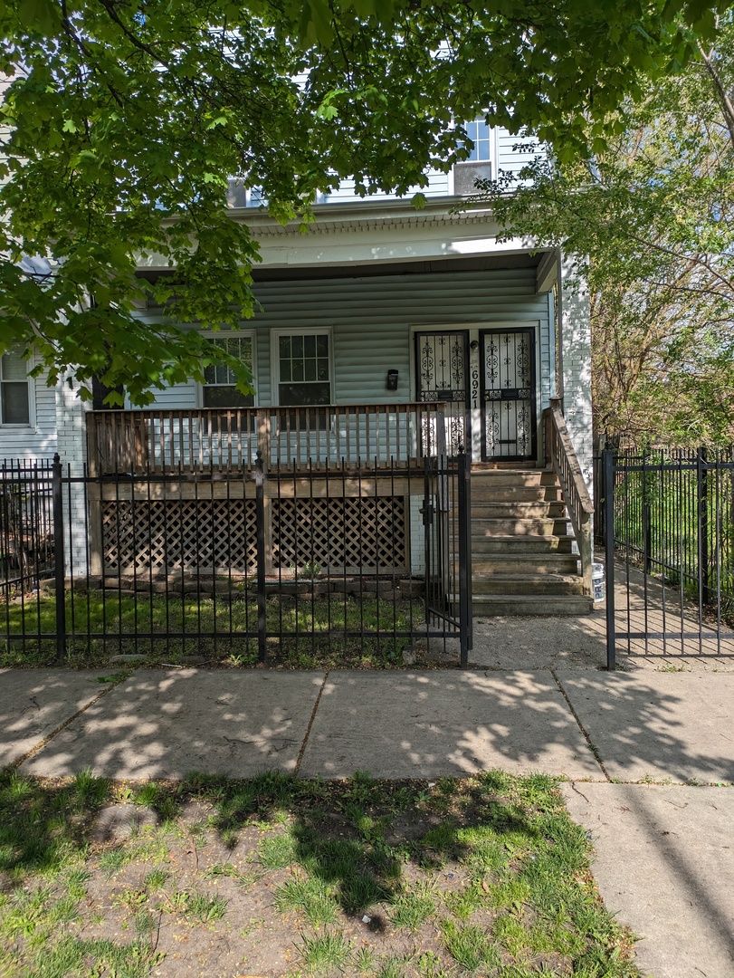 6921 South Normal Boulevard Chicago, IL 60621 - Photo 1 of 1 a view of a house with a yard
