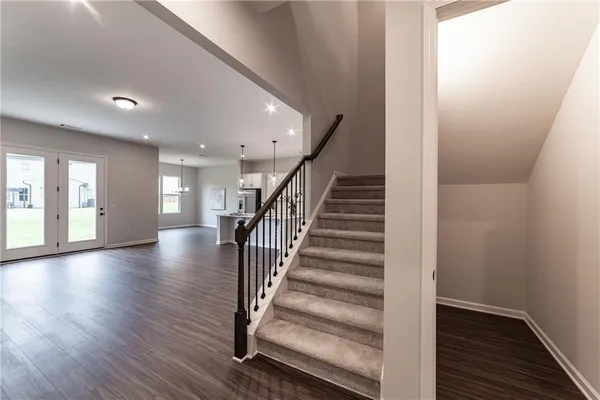 a bathroom with a tub and a mirror