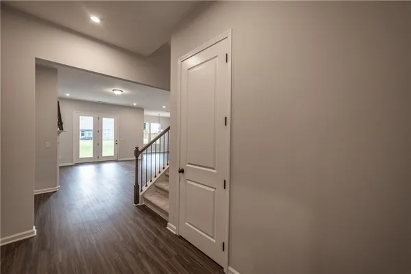 a view of kitchen with wooden floor and electronic appliances