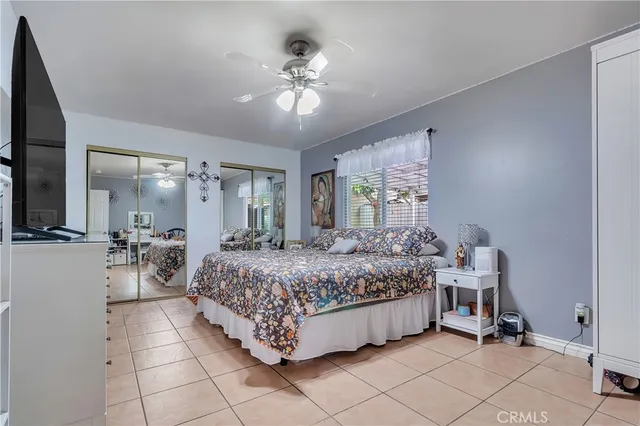 a bed room with a bed and a chandelier