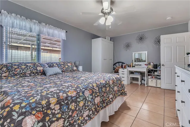 a bed room with a bed and a chandelier