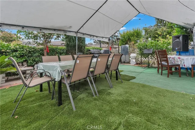 a view of a yard with furniture and a yard