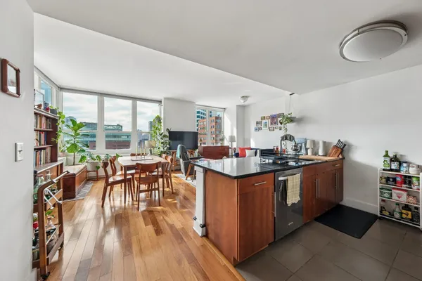 a kitchen with stainless steel appliances granite countertop a stove and cabinets