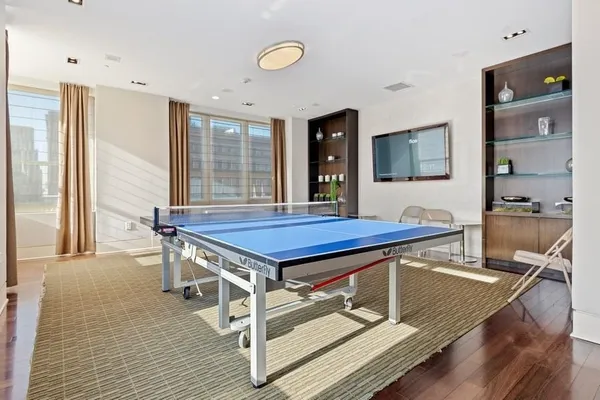 a view of a livingroom with furniture and a flat screen tv