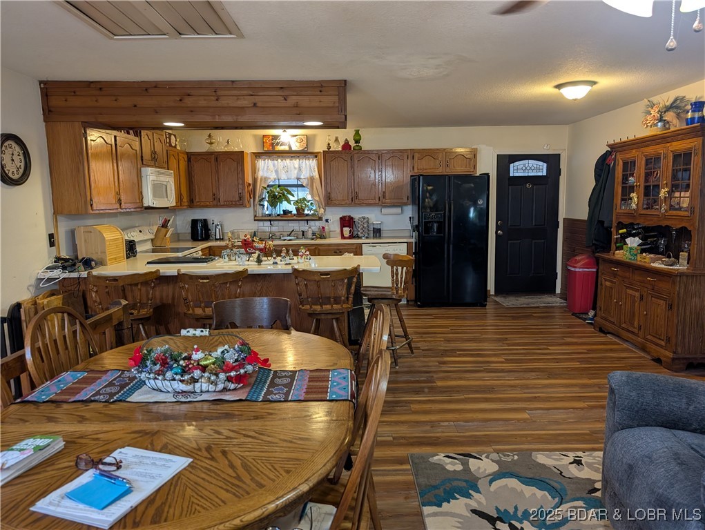722 Riley Ridge Road Linn Creek, MO 65052 - Photo 16 of 52 Table into the kitchen