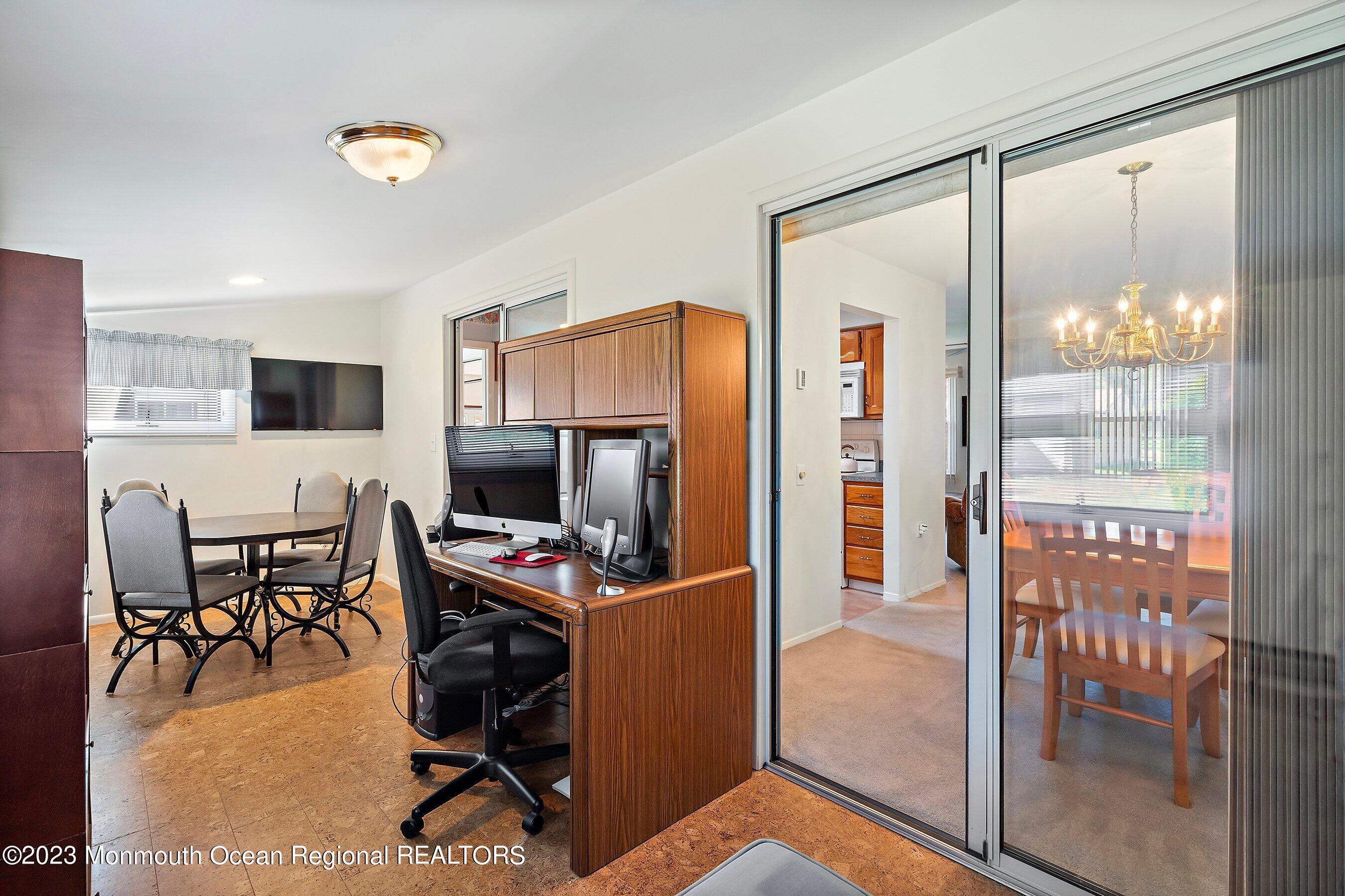 9 Amherst Road, Unit 64 Whiting, NJ 08759 - Photo 16 of 30 a view of a livingroom with furniture and a flat screen tv