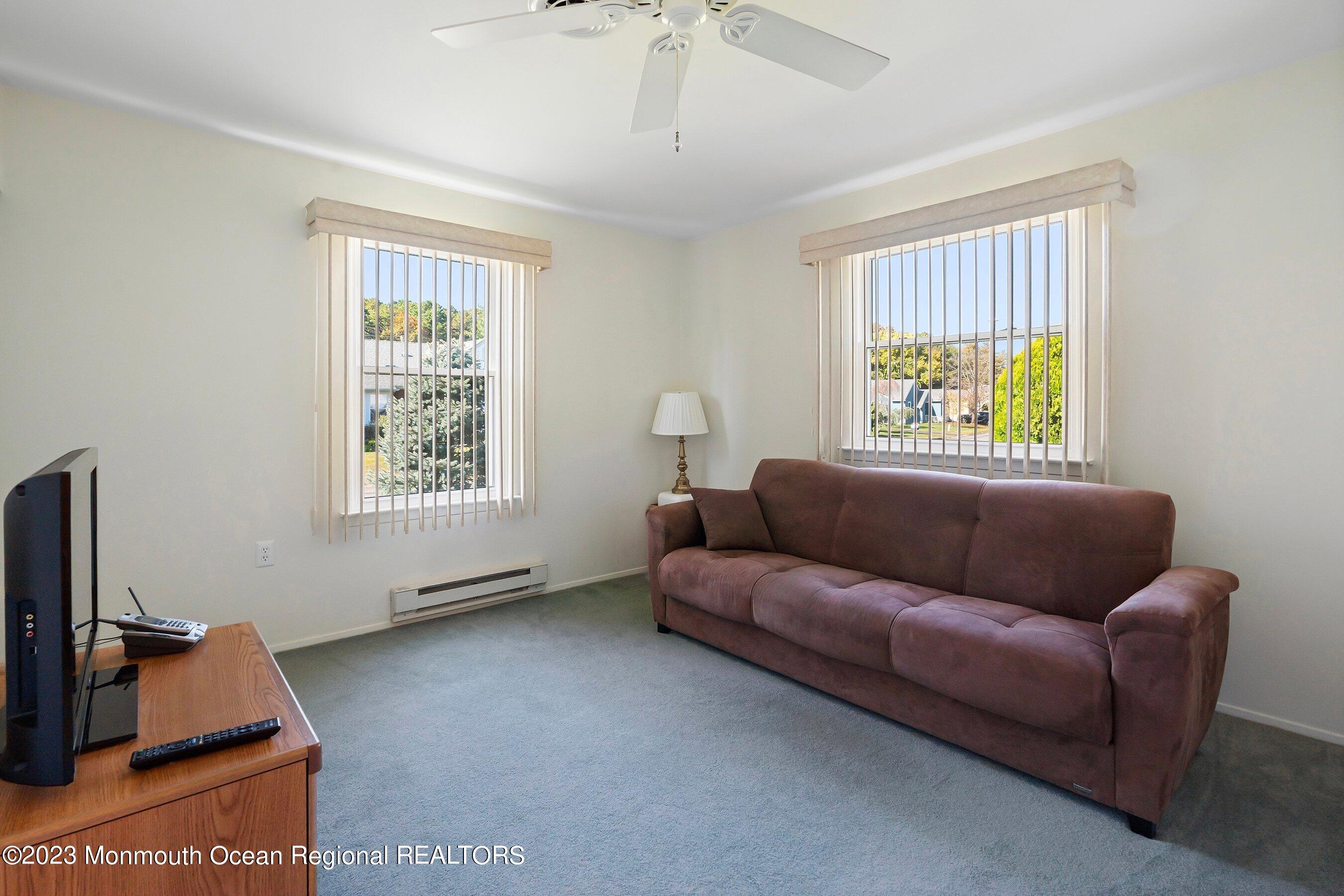 9 Amherst Road, Unit 64 Whiting, NJ 08759 - Photo 21 of 30 a living room with furniture and a window