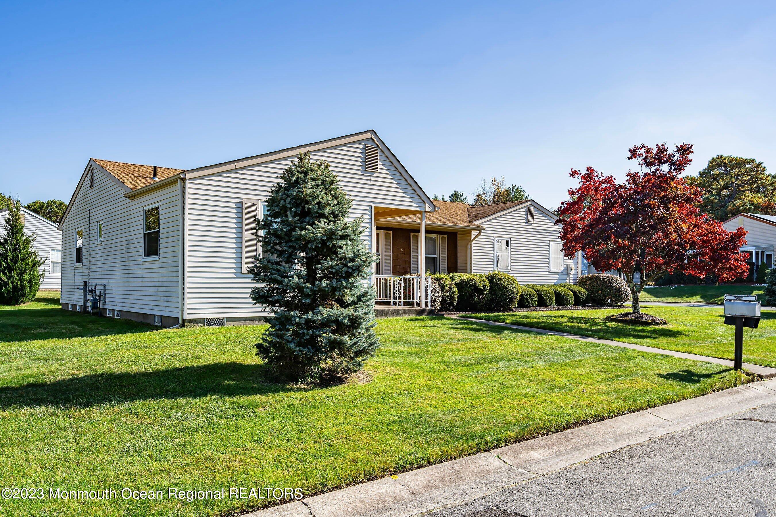 9 Amherst Road, Unit 64 Whiting, NJ 08759 - Photo 5 of 30 a front view of house with yard and green space
