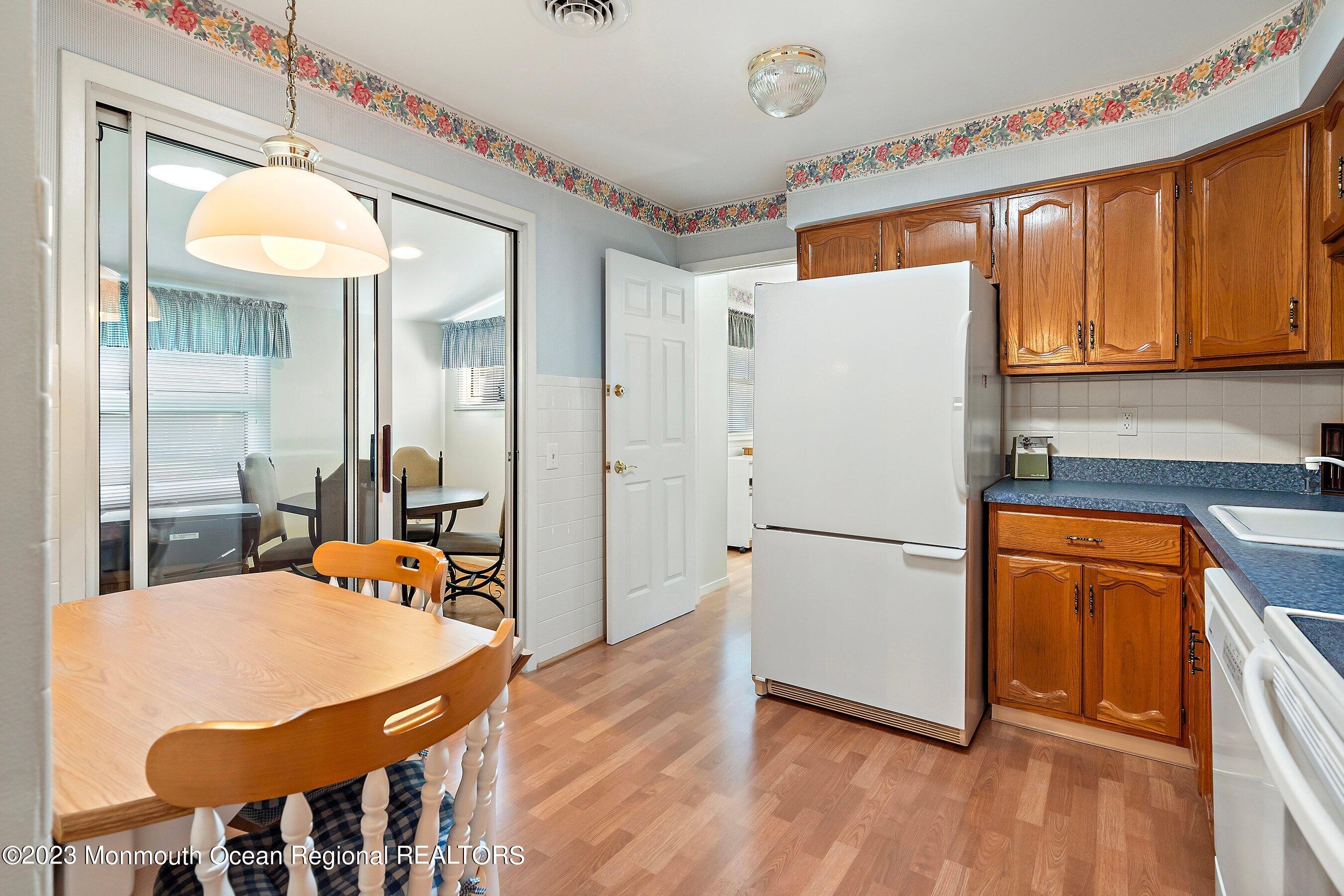 9 Amherst Road, Unit 64 Whiting, NJ 08759 - Photo 7 of 30 a white refrigerator freezer sitting inside of a kitchen