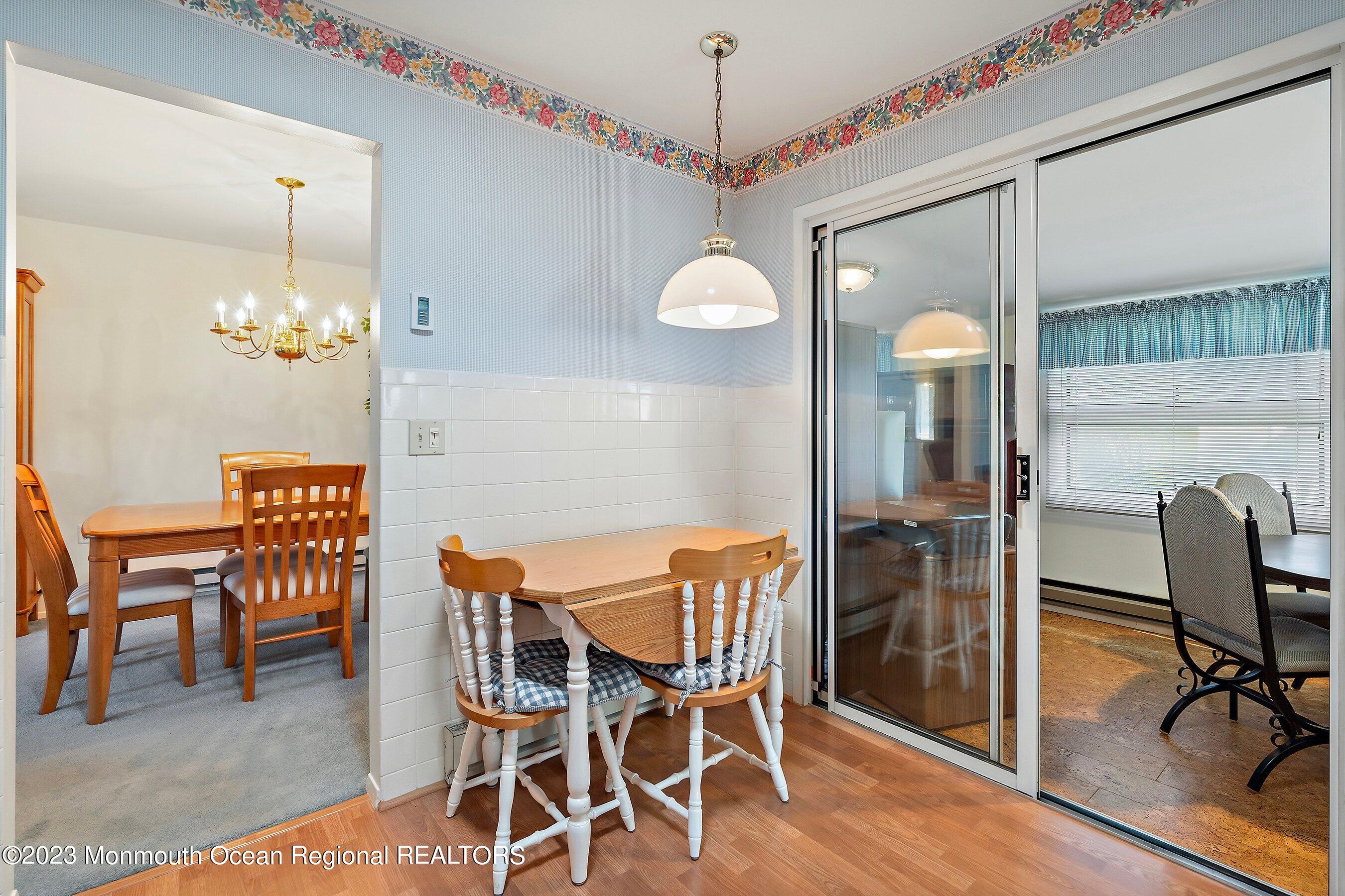 9 Amherst Road, Unit 64 Whiting, NJ 08759 - Photo 8 of 30 a view of a dining room with furniture and chandelier