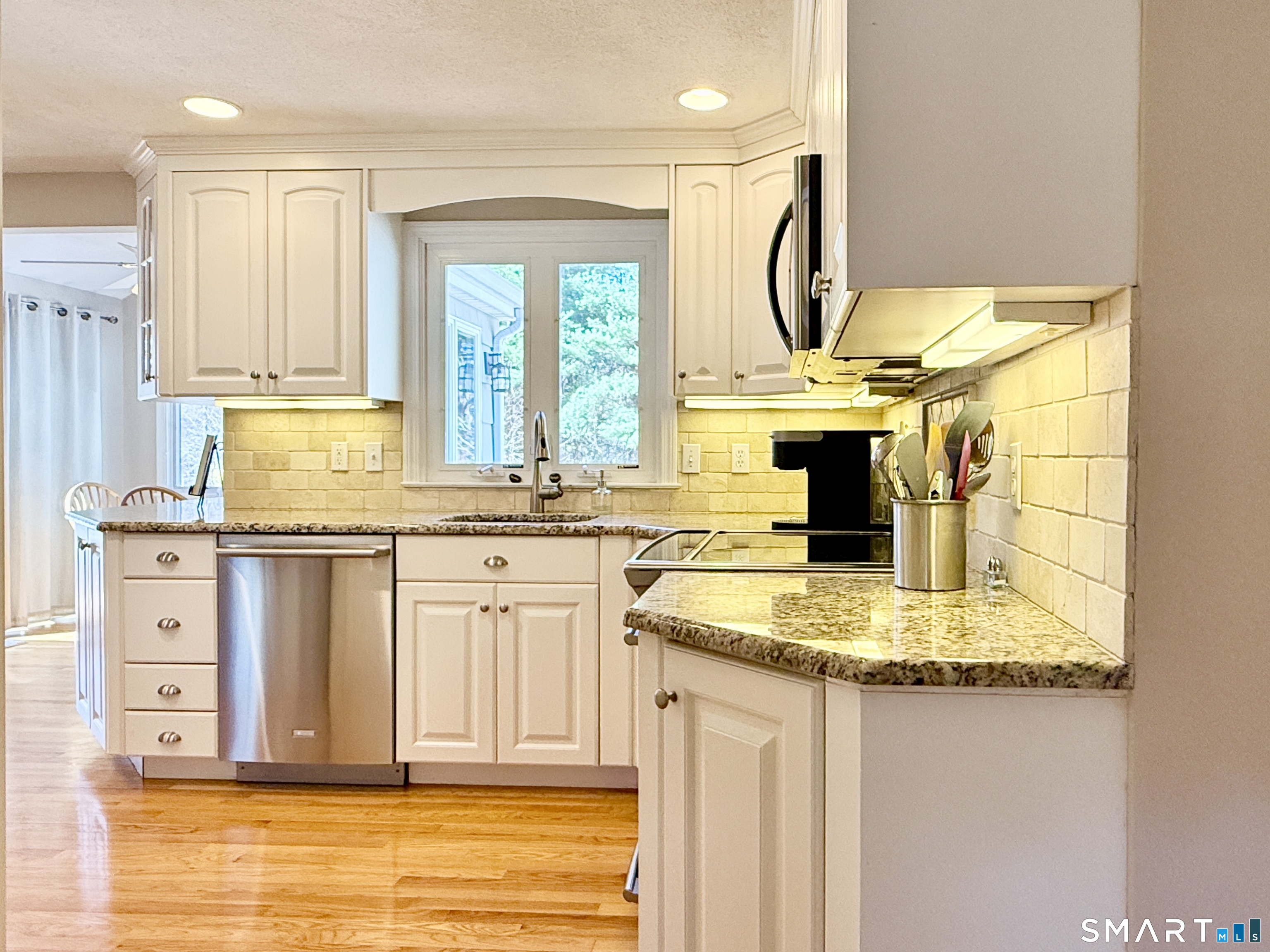 17 Sunnybrook Drive Avon, CT 06001 - Photo 13 of 40 a view of living room with granite countertop furniture and a window