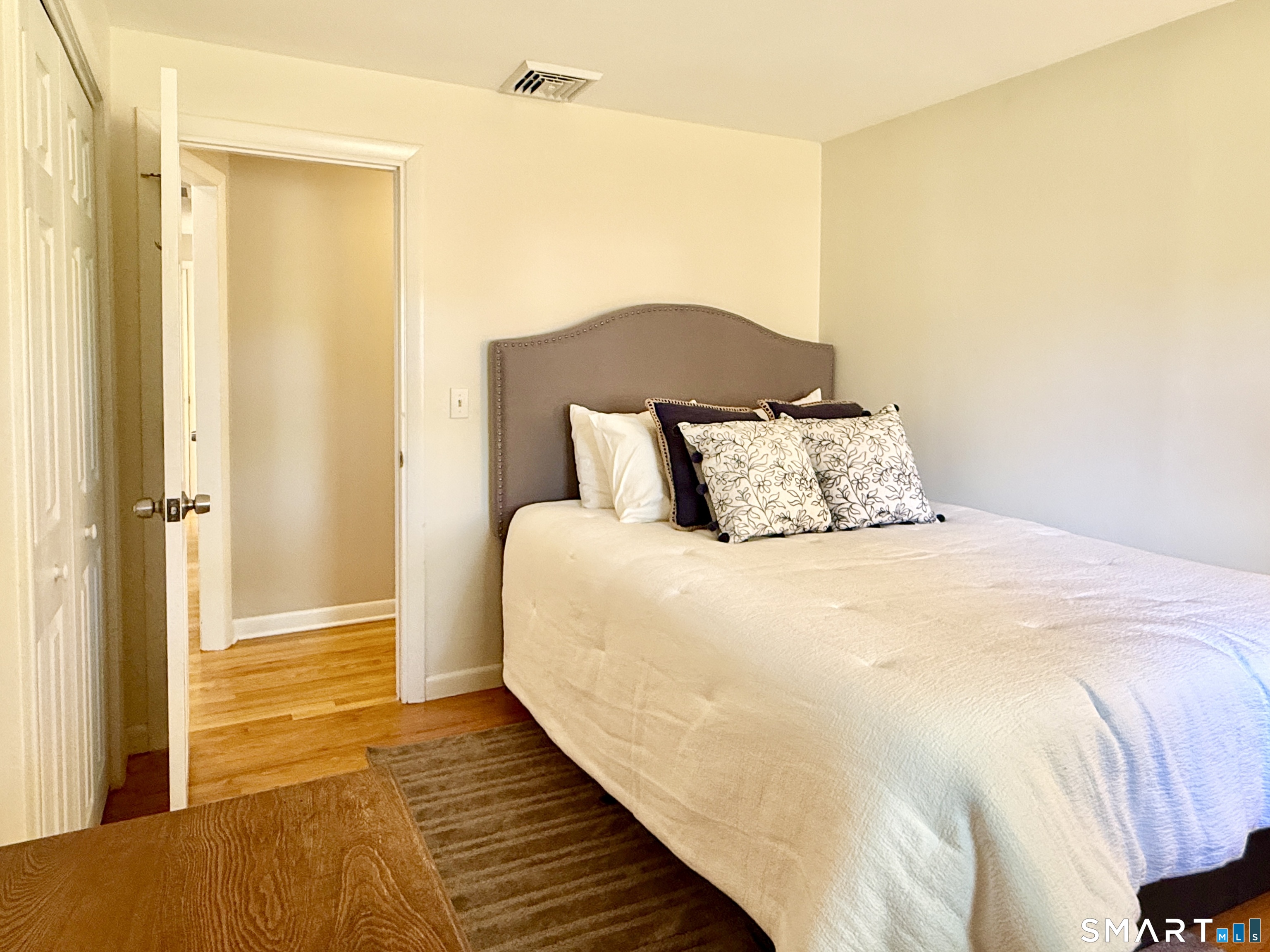 17 Sunnybrook Drive Avon, CT 06001 - Photo 25 of 40 a bedroom with a bed and wooden floor