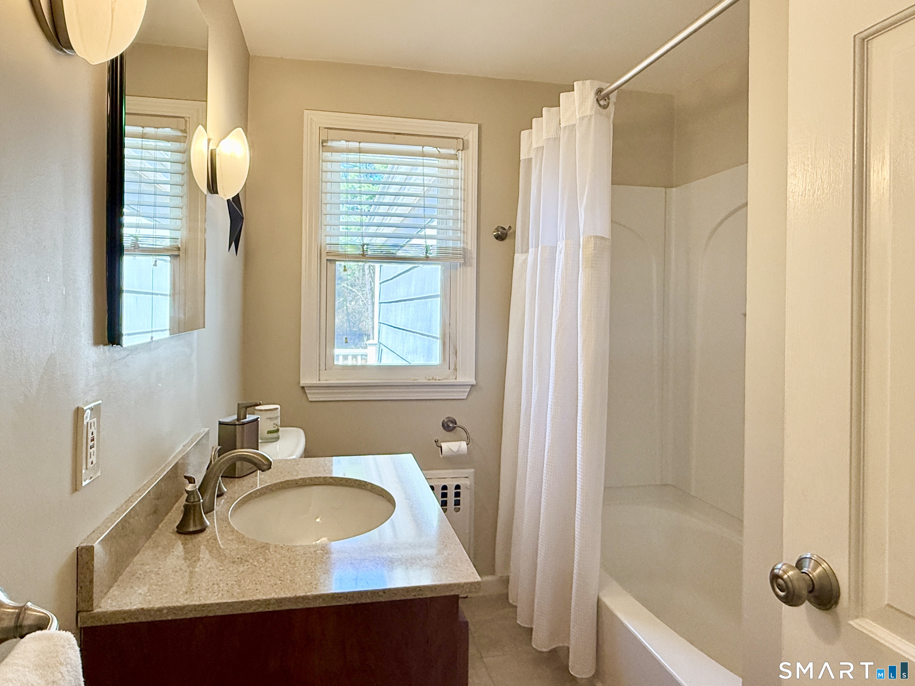 17 Sunnybrook Drive Avon, CT 06001 - Photo 26 of 40 a bathroom with a sink and a mirror