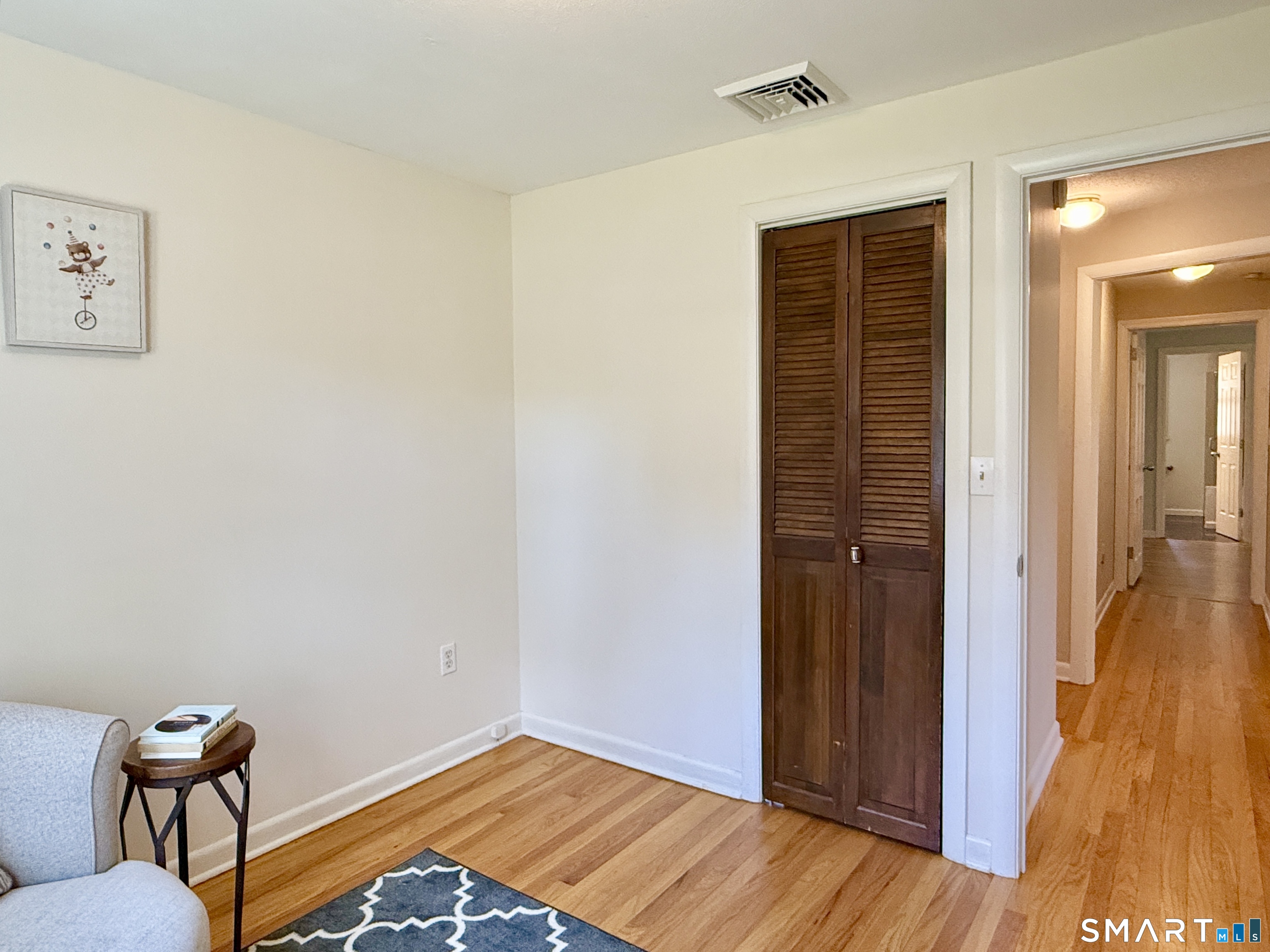 17 Sunnybrook Drive Avon, CT 06001 - Photo 28 of 40 a view of a livingroom with wooden floor and closet