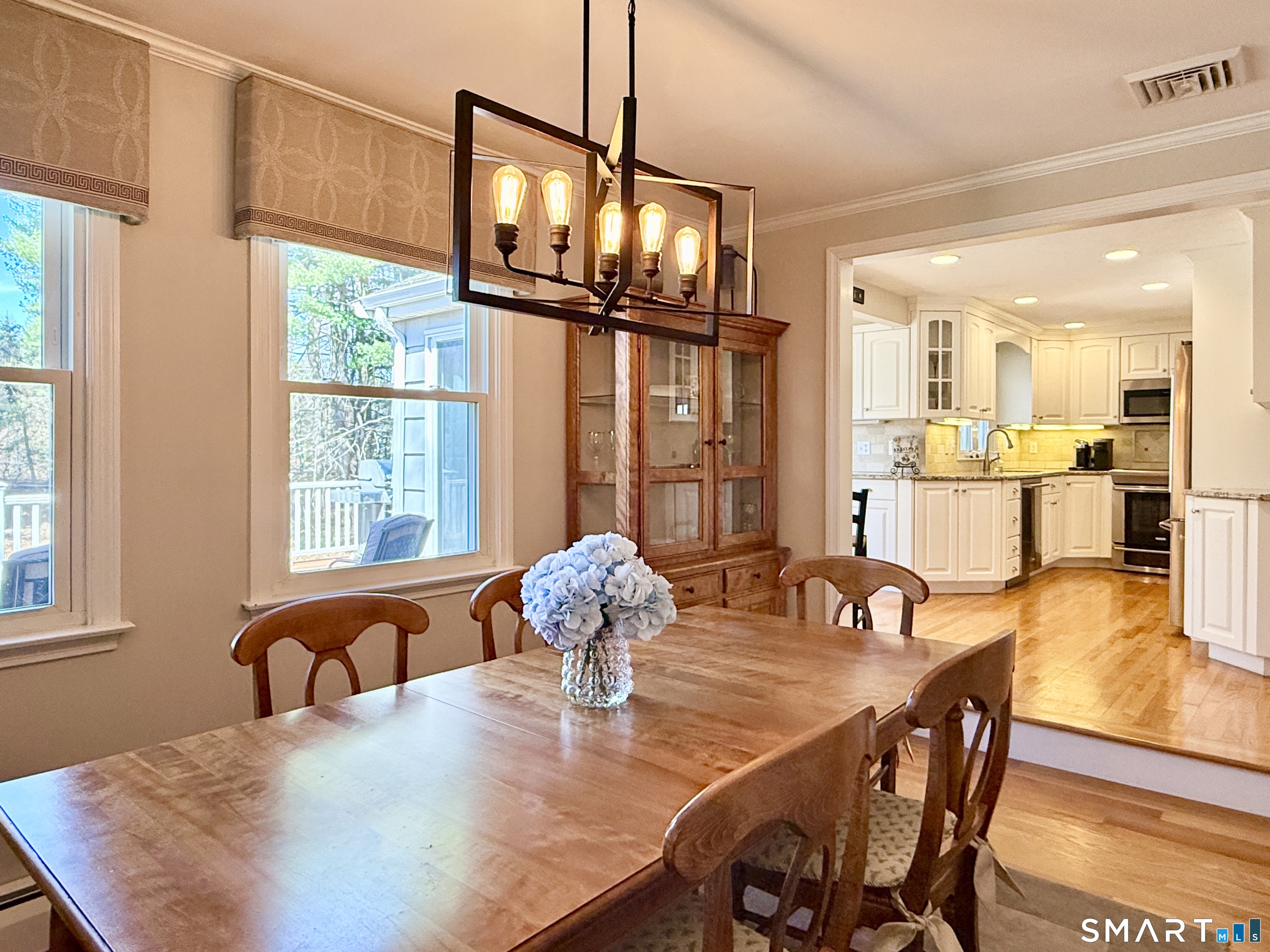 17 Sunnybrook Drive Avon, CT 06001 - Photo 8 of 40 a view of a dining room with furniture a chandelier and wooden floor
