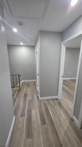 wooden floor in an empty room with a mirror