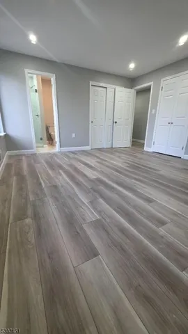 a view of a livingroom with wooden floor