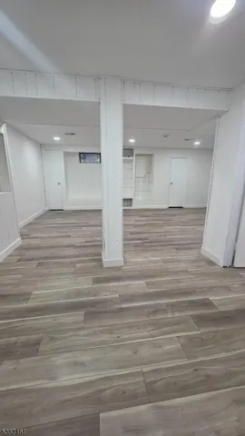 an empty room with wooden floor