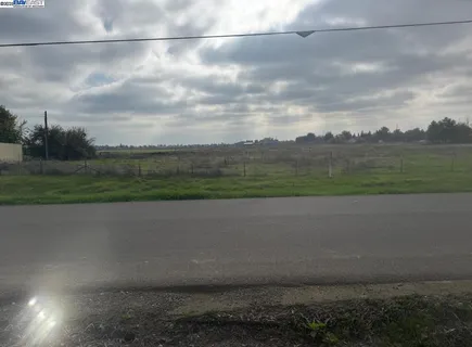 a view of a yard and mountain view