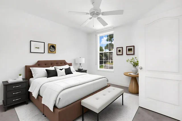 an empty room with chandelier fan