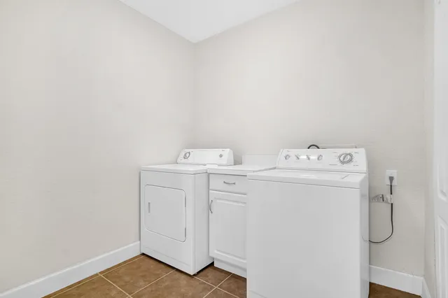 a view of room that has a white walls