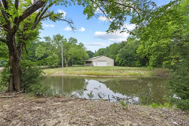 a view of a water fountain with a yard