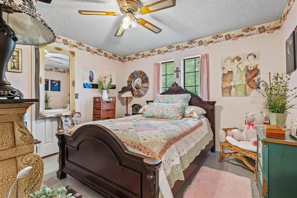 a bed room with a bed and a chandelier