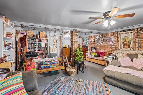a living room filled with furniture and a chandelier