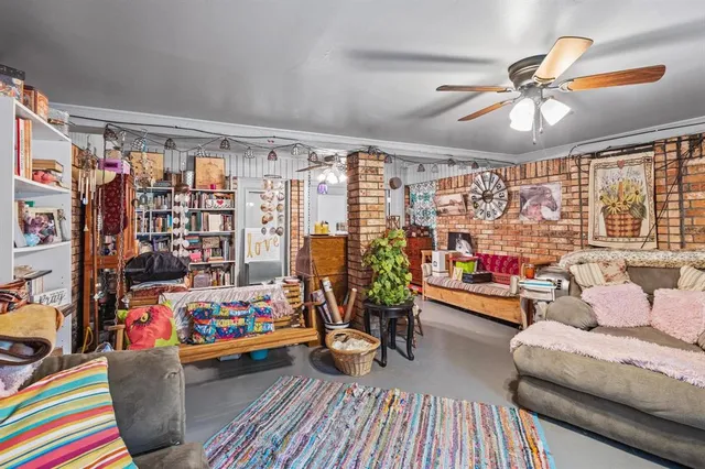 a living room filled with furniture and a chandelier
