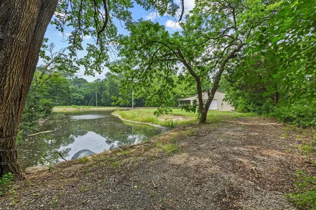 a view of a lake with a yard