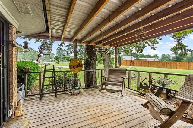 a view of a patio with wooden floor