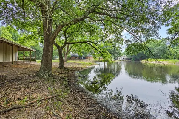 a backyard of a house with a lake view