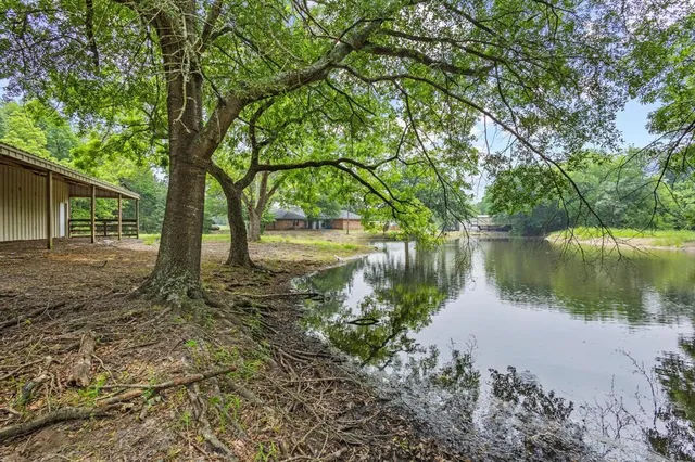 a backyard of a house with a lake view