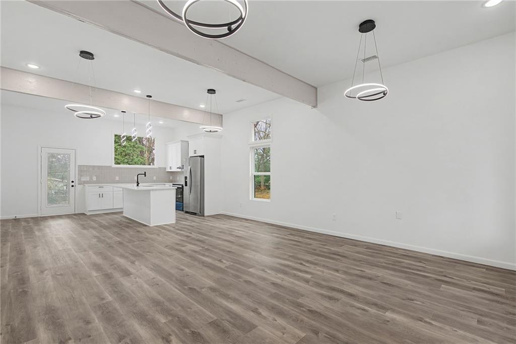 1667 Thornton Place Southwest Atlanta, GA 30315 - Photo 6 of 41 a view of a kitchen with furniture and wooden floor