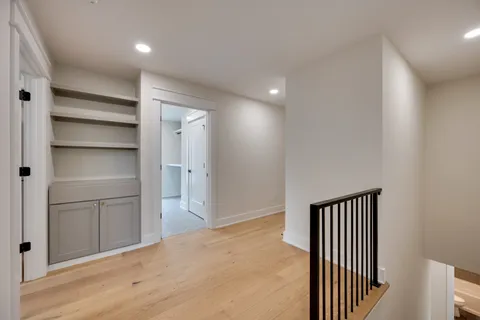 a view of a hallway with closet area