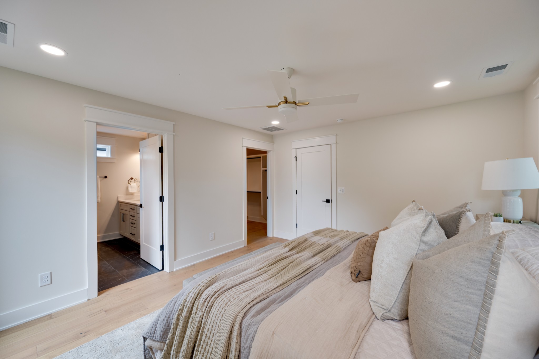 704 Stockell Street Nashville, TN 37207 - Photo 14 of 32 a bedroom with a large bed and a chandelier