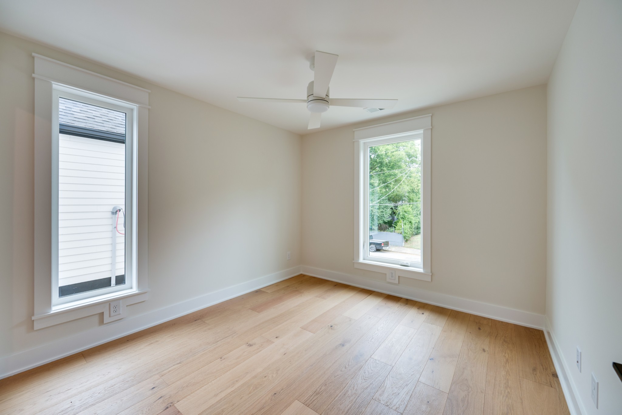 704 Stockell Street Nashville, TN 37207 - Photo 18 of 32 a view of an empty room with wooden floor and a window