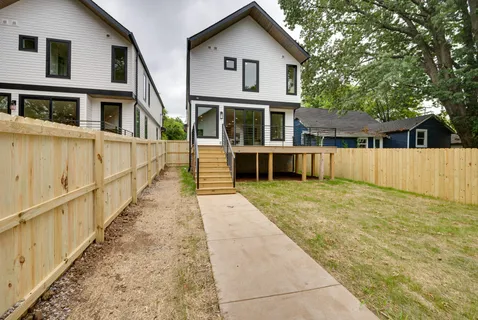 a view of house with a yard