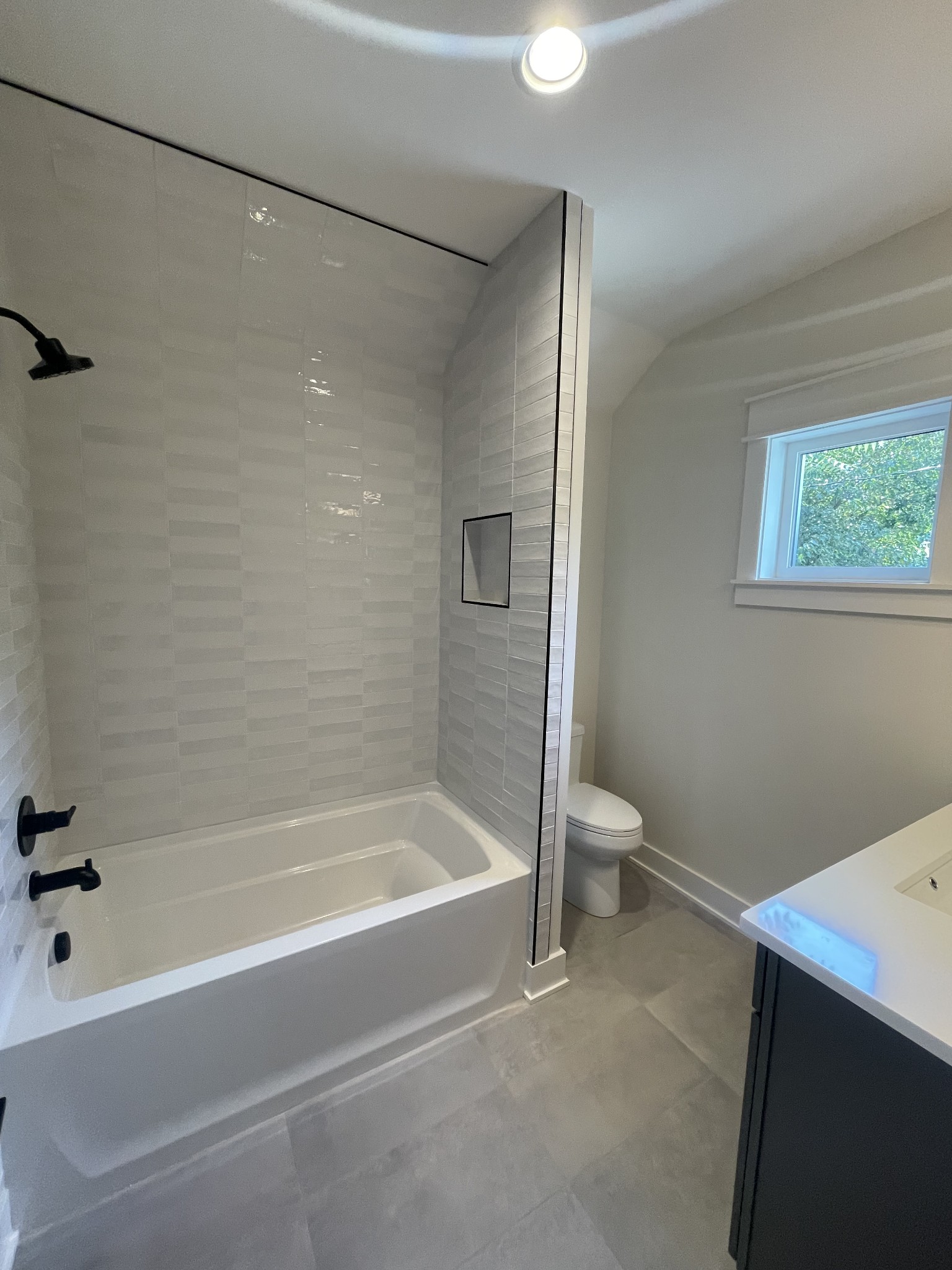 704 Stockell Street Nashville, TN 37207 - Photo 30 of 32 a bathroom with a bathtub and a shower