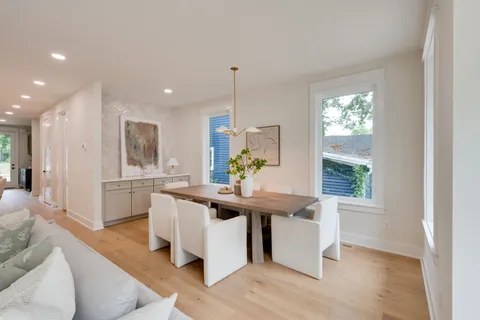 a kitchen with stainless steel appliances granite countertop a sink stove and a refrigerator