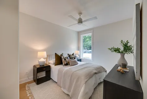 a bedroom with furniture and a chandelier